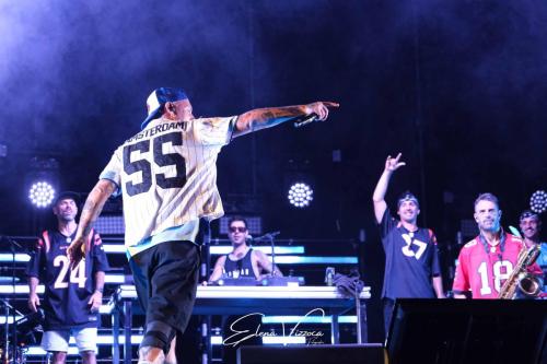 Clemente Maccaro, aka Clementino (L), performs live during his tour at the Arena del Mare 42°15° in Termoli, Italy